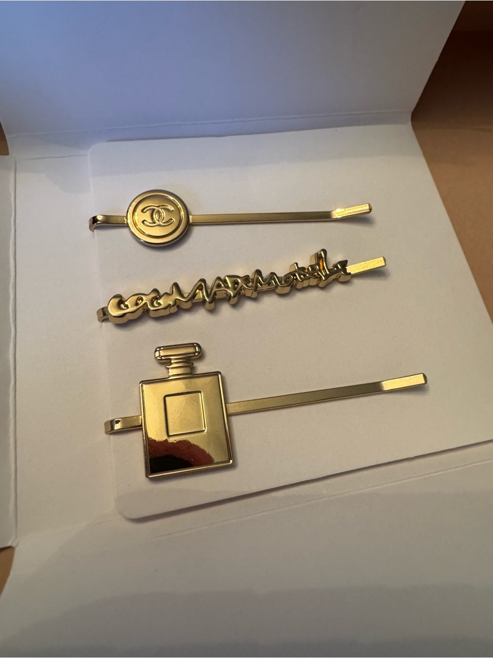 Louis Vuitton Gold-Tone Men’s Hairpin Set with Emblem & Perfume Motif